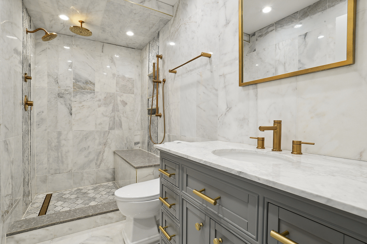 647 Rockhurst Road Bolingbrook, IL 60440 - Photo 7 of 14 a bathroom with a granite countertop sink a toilet and a shower
