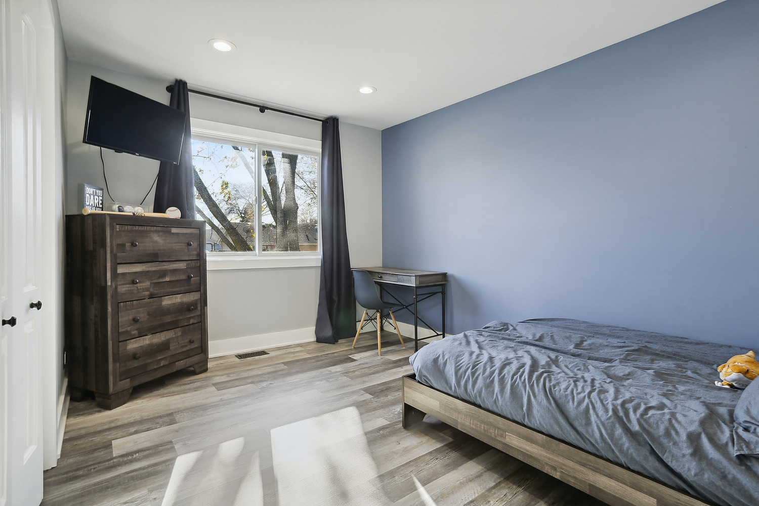 647 Rockhurst Road Bolingbrook, IL 60440 - Photo 8 of 14 a bedroom with a bed and a window