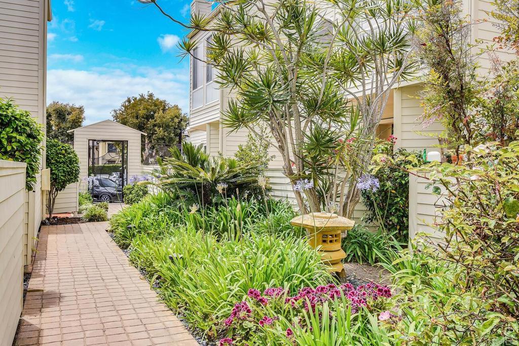 7585 Eads Avenue, Unit C La Jolla, CA 92037 - Photo 23 of 29 a view of a garden with pathway
