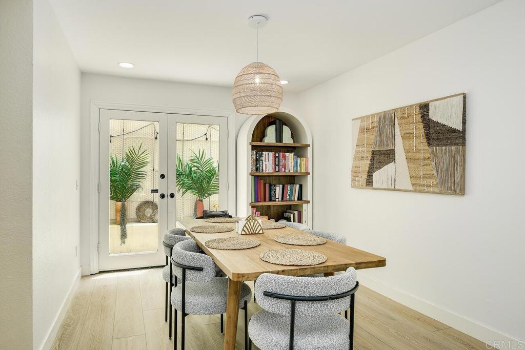 7585 Eads Avenue, Unit C La Jolla, CA 92037 - Photo 9 of 29 a view of a dining room with furniture window and wooden floor