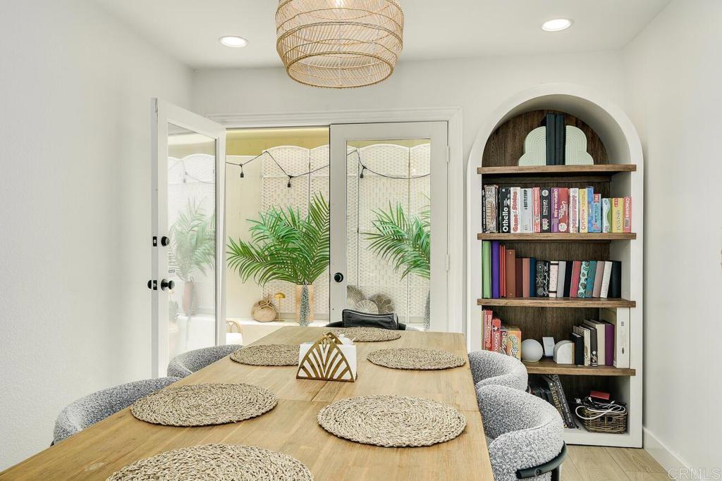 7585 Eads Avenue, Unit C La Jolla, CA 92037 - Photo 10 of 29 a living room with furniture and a book shelf