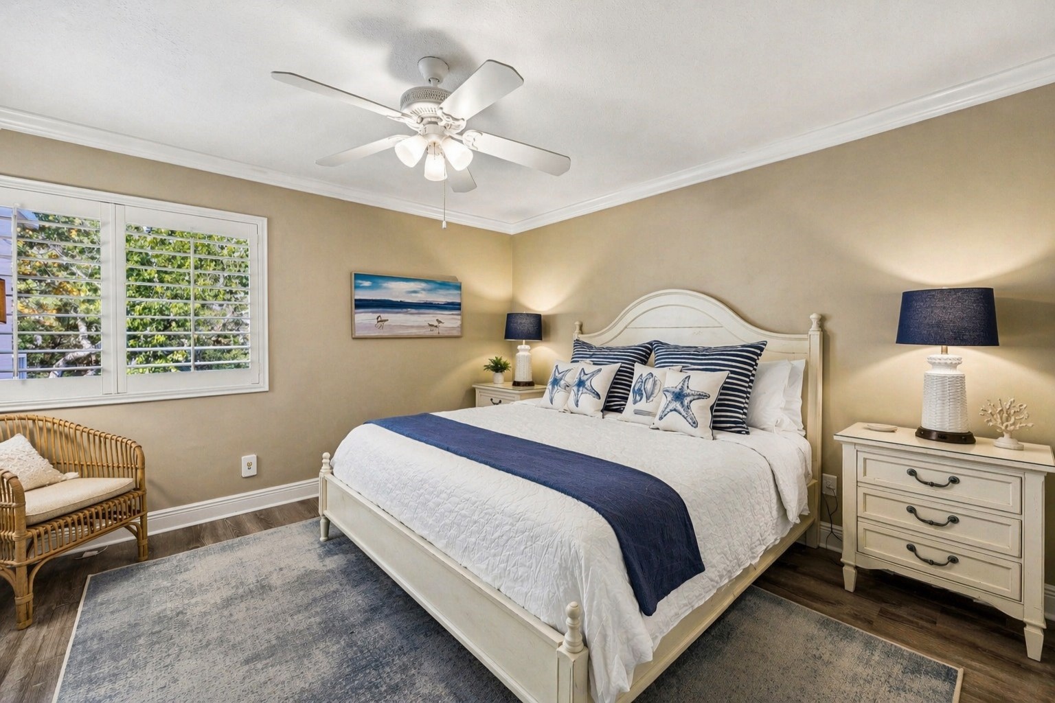 2117 Beachwood Road, Unit 2117 Fernandina Beach, FL 32034 - Photo 9 of 36 a bedroom with a bed and a chandelier