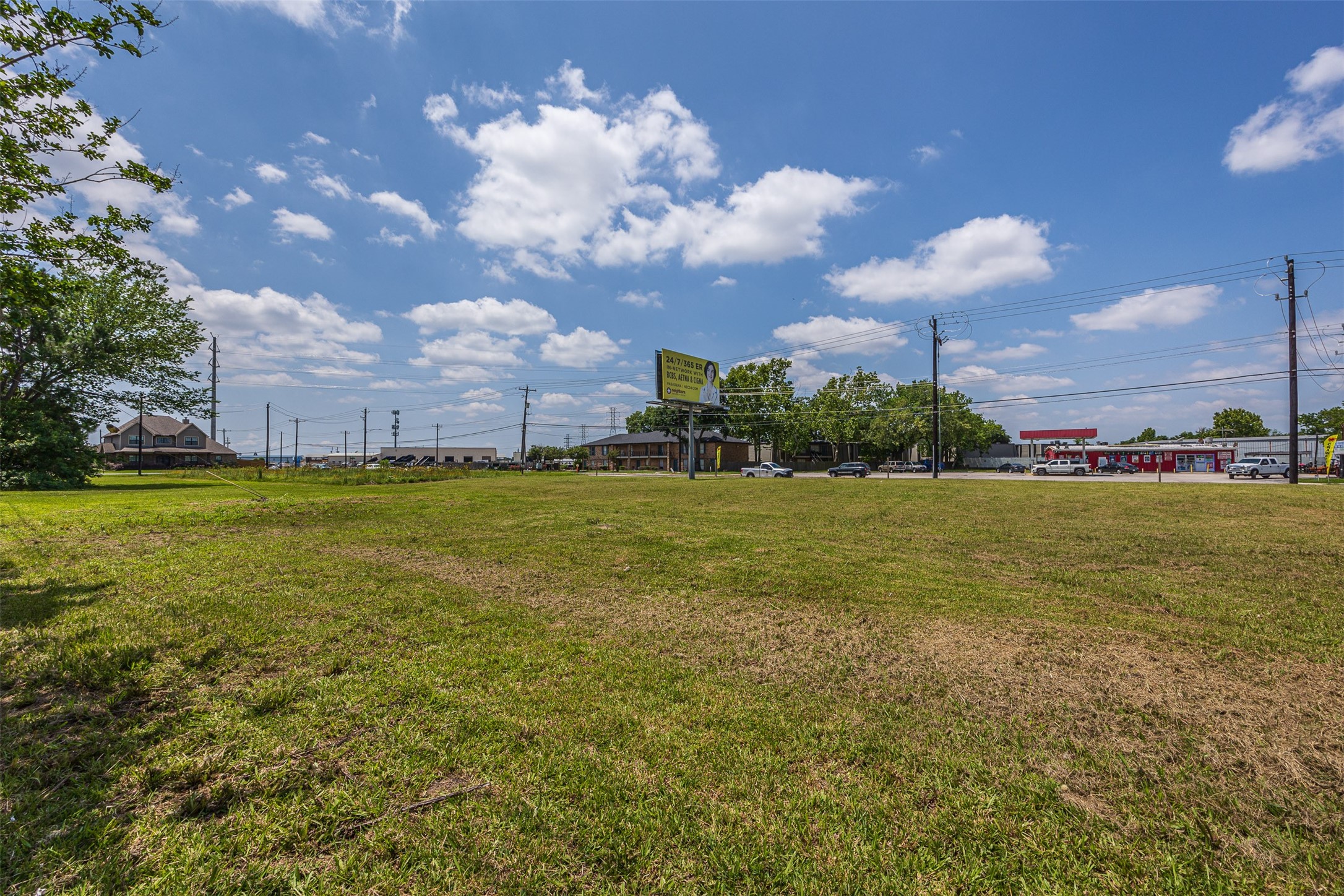 5905-5909 Red Bluff Road Pasadena, TX 77505 - Photo 5 of 10 a view of a building in the middle of a yard