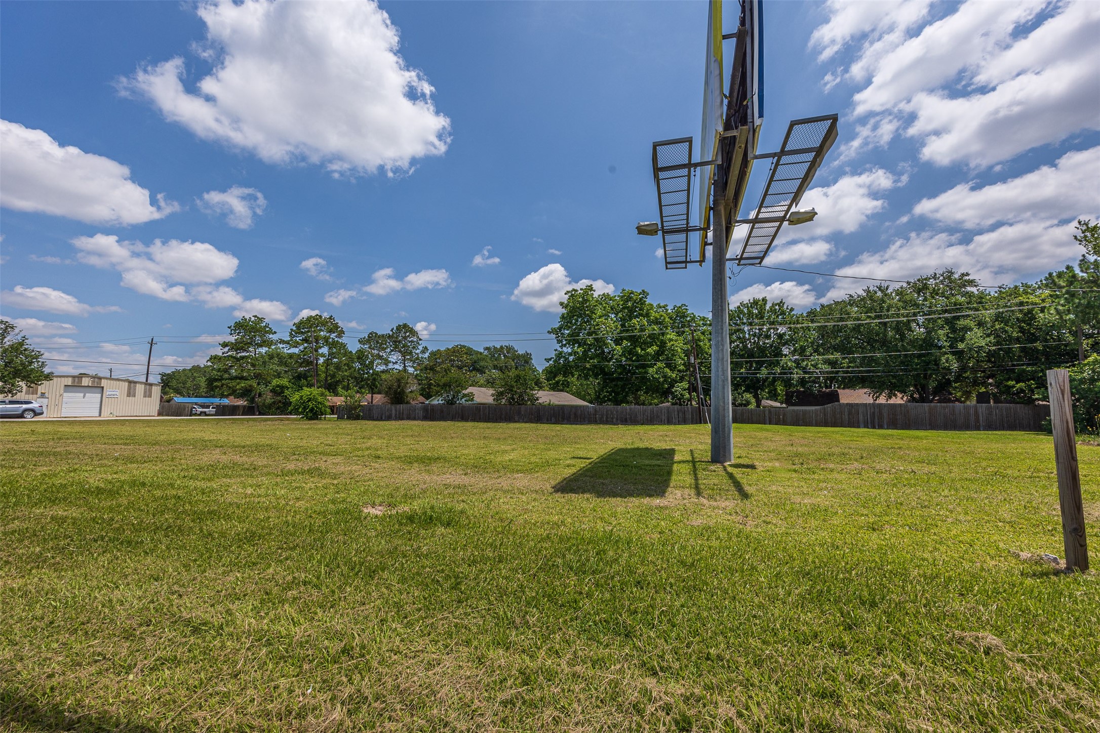 5905-5909 Red Bluff Road Pasadena, TX 77505 - Photo 9 of 10 a view of a fountain in front of a house with a yard