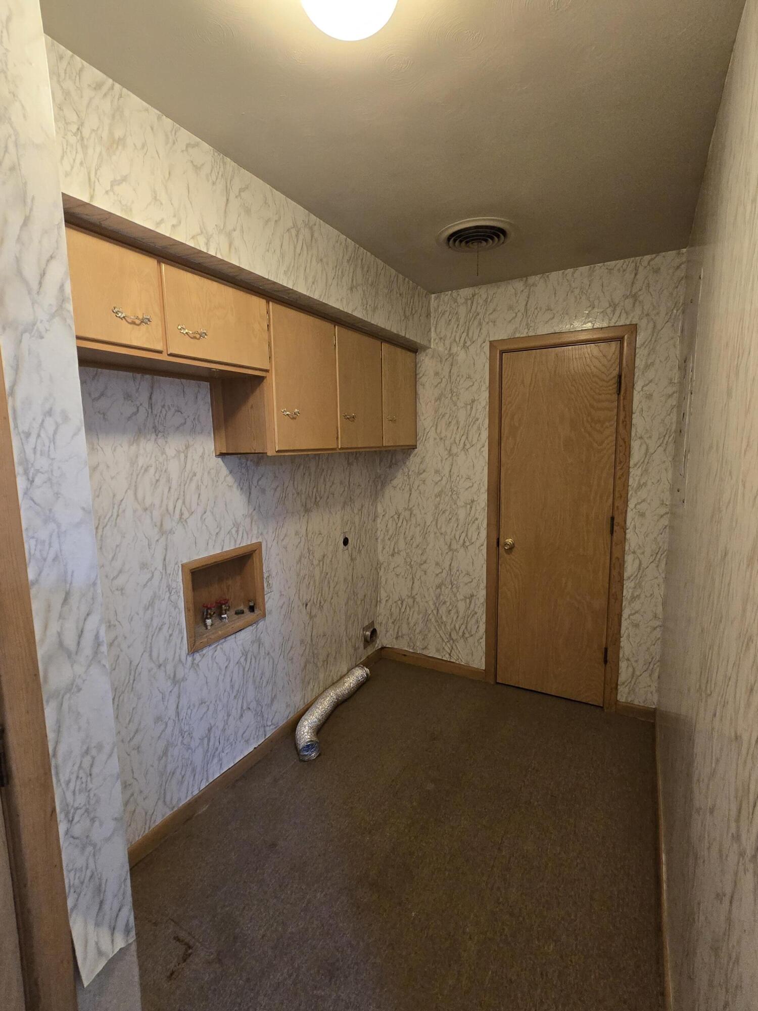 2229 South 6th Street Lamesa, TX 79331 - Photo 20 of 27 a view of a storage & utility room with a door