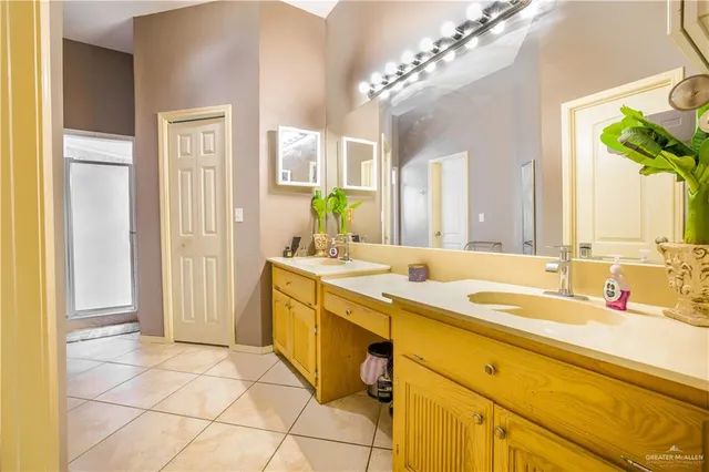 a spacious bathroom with a double vanity sink mirror and