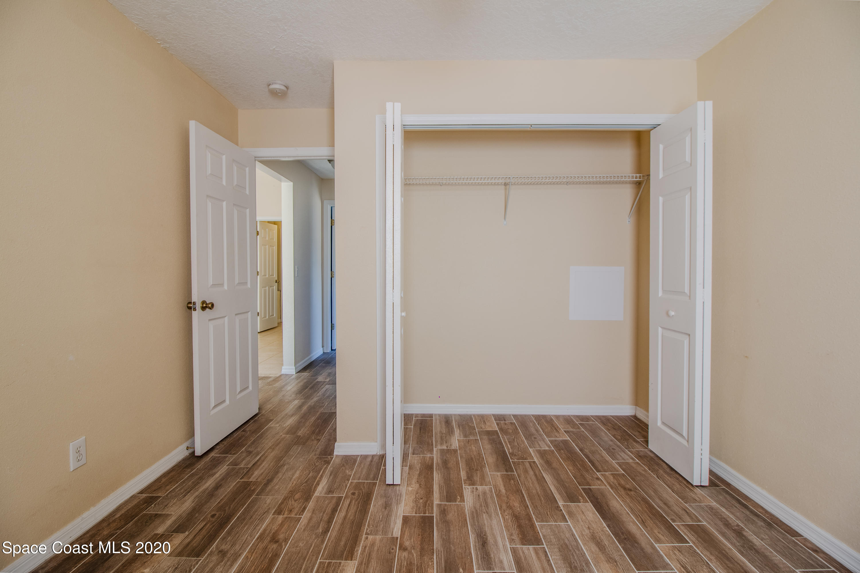 5345 Cangro Street Cocoa, FL 32926 - Photo 17 of 28 a view of a room with wooden floor