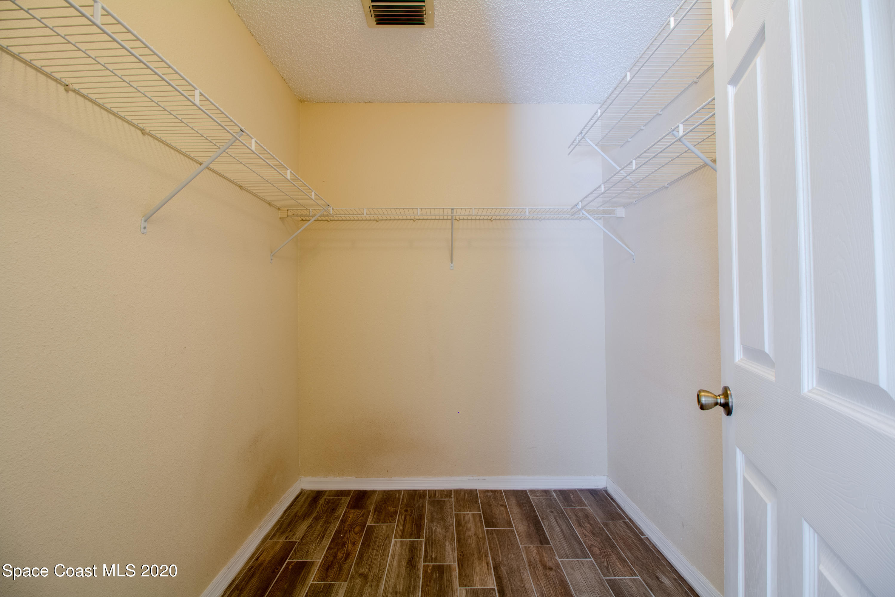5345 Cangro Street Cocoa, FL 32926 - Photo 26 of 28 a view of a room with rack on the wall