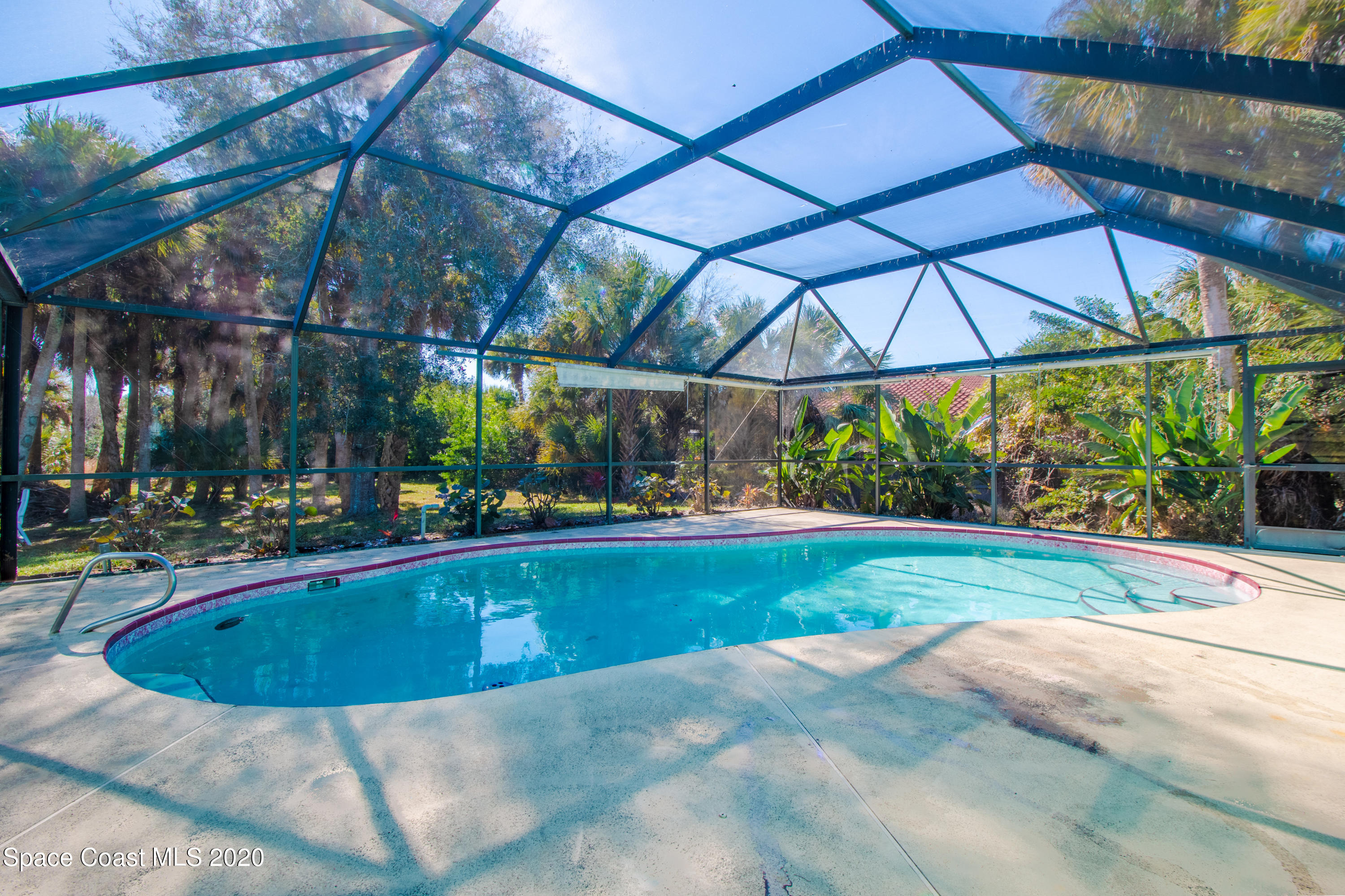 5345 Cangro Street Cocoa, FL 32926 - Photo 27 of 28 a view of a swimming pool with a patio