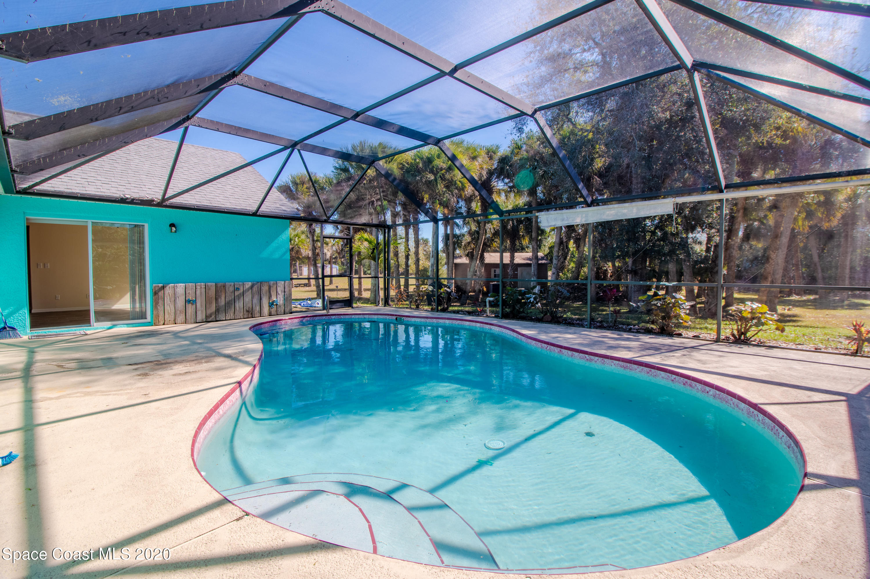 5345 Cangro Street Cocoa, FL 32926 - Photo 28 of 28 a view of a swimming pool with a porch