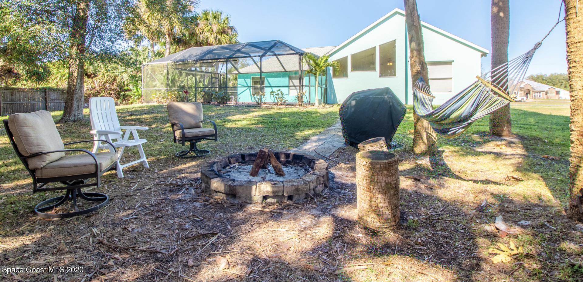 5345 Cangro Street Cocoa, FL 32926 - Photo 4 of 28 a front view of a house with garden and sitting area
