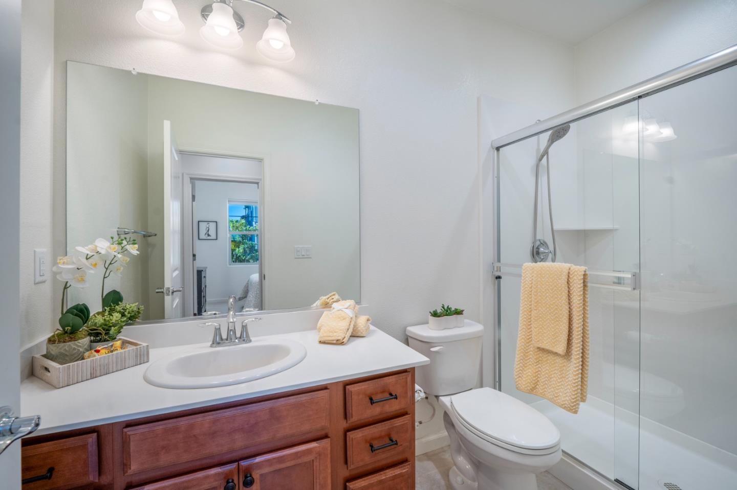 712 Baxter Way Gilroy, CA 95020 - Photo 12 of 37 a bathroom with a sink toilet and shower