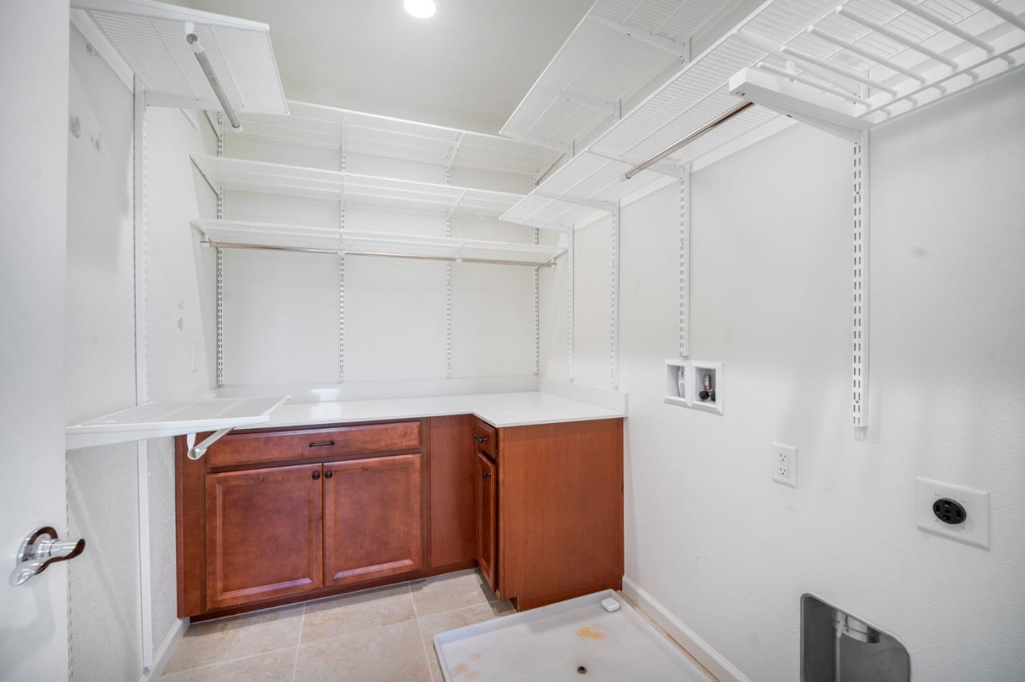 712 Baxter Way Gilroy, CA 95020 - Photo 21 of 37 a room with cabinets and wooden door