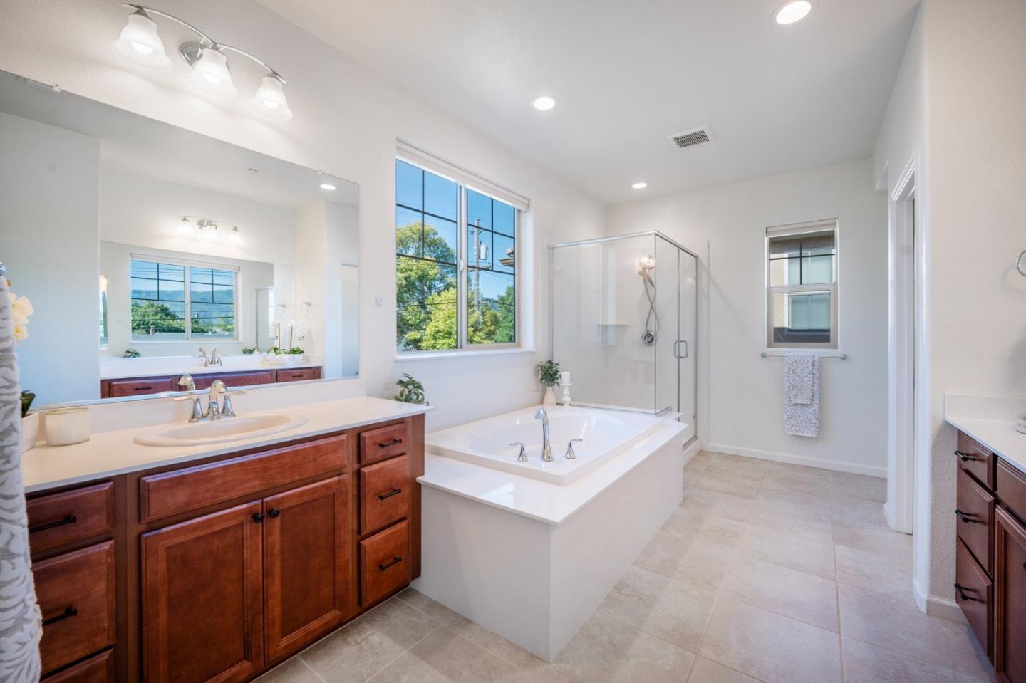 712 Baxter Way Gilroy, CA 95020 - Photo 25 of 37 a spacious bathroom with a double vanity sink mirror and bathtub