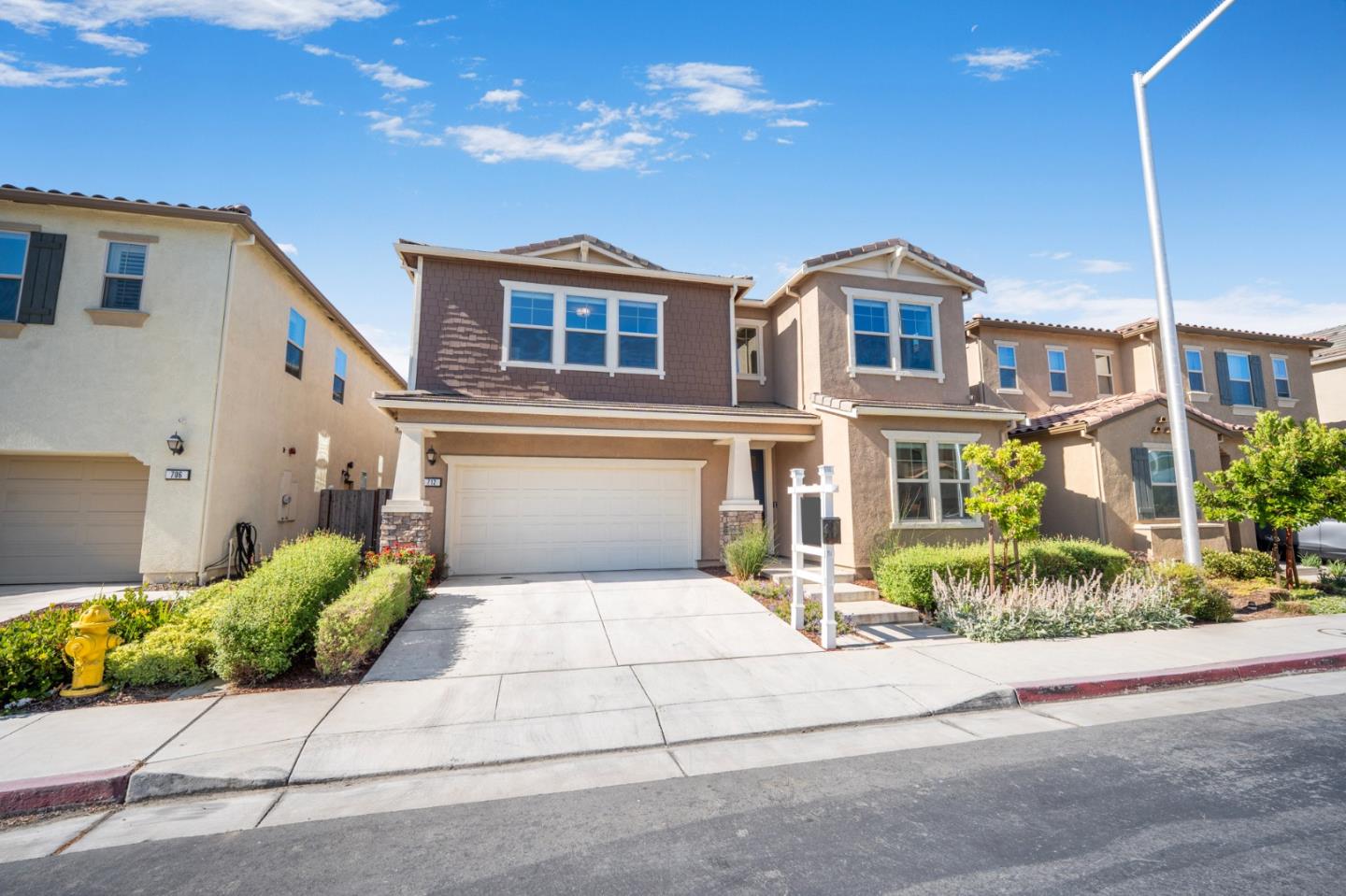 712 Baxter Way Gilroy, CA 95020 - Photo 33 of 37 a front view of a house with a garden