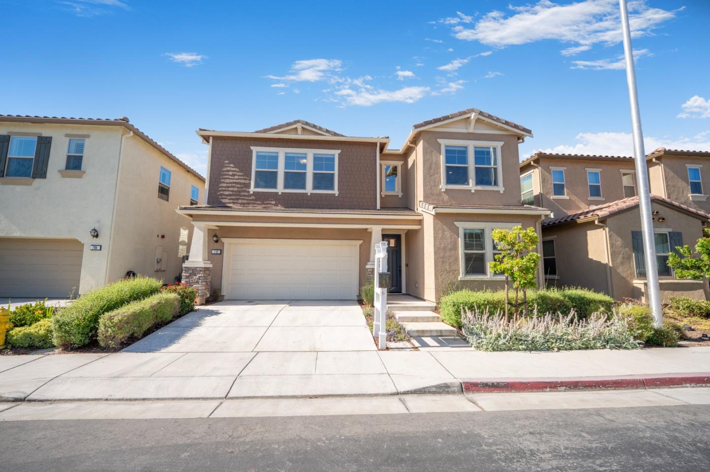 712 Baxter Way Gilroy, CA 95020 - Photo 34 of 37 a front view of a house with a garden