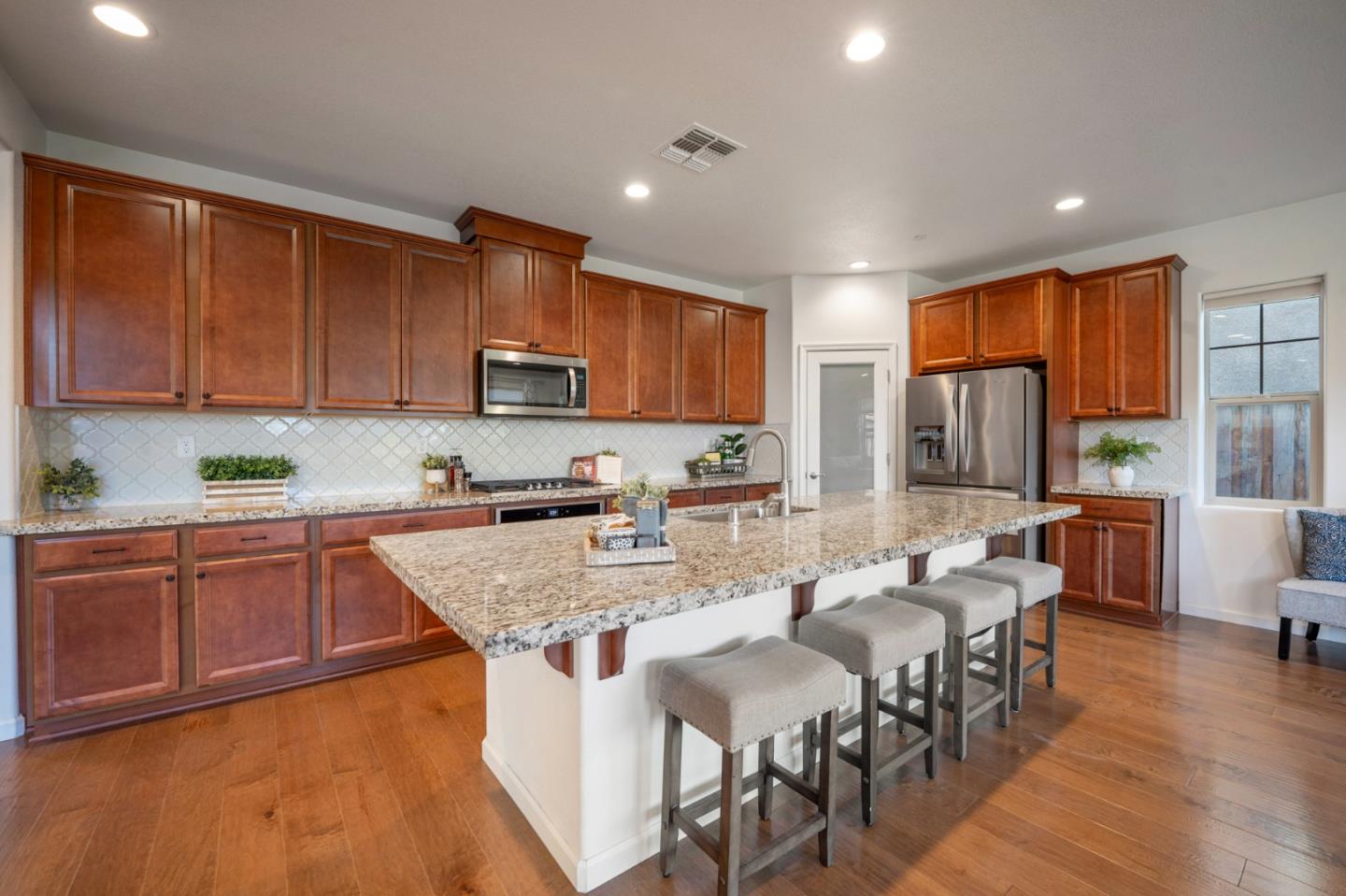 712 Baxter Way Gilroy, CA 95020 - Photo 4 of 37 a large kitchen with lots of counter space a sink and appliances