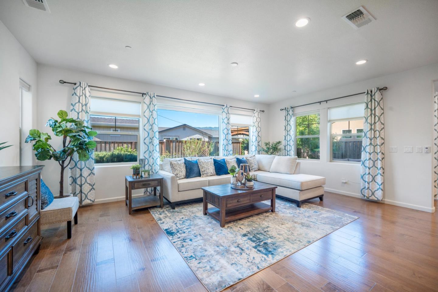 712 Baxter Way Gilroy, CA 95020 - Photo 5 of 37 a living room with furniture and a large window