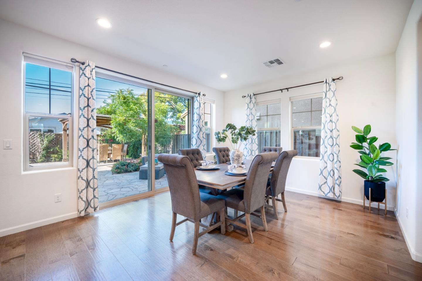 712 Baxter Way Gilroy, CA 95020 - Photo 8 of 37 a view of a dining room with furniture window and wooden floor