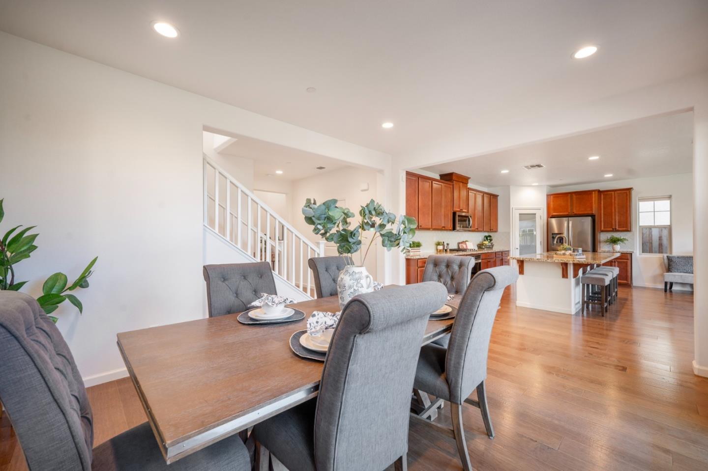 712 Baxter Way Gilroy, CA 95020 - Photo 9 of 37 a view of a dining room with furniture and wooden floor