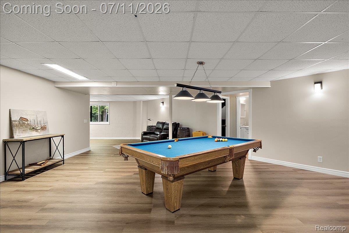 4219 Gardner Road Metamora, MI 48455 - Photo 49 of 87 Spacious recreation room featuring wood-finish flooring and a drop ceiling with recessed lighting