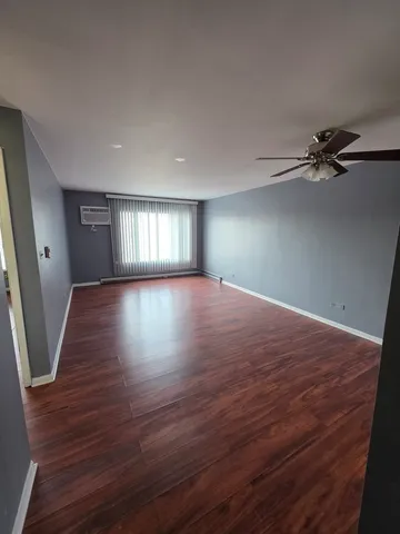 a kitchen with a refrigerator sink and cabinets