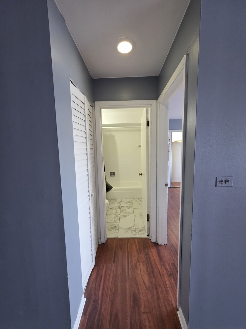 336 Lathrop Avenue, Unit 502 Forest Park, IL 60130 - Photo 14 of 38 a view of a hallway with wooden floor
