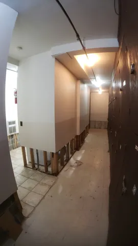 a bathroom with a glass shower door