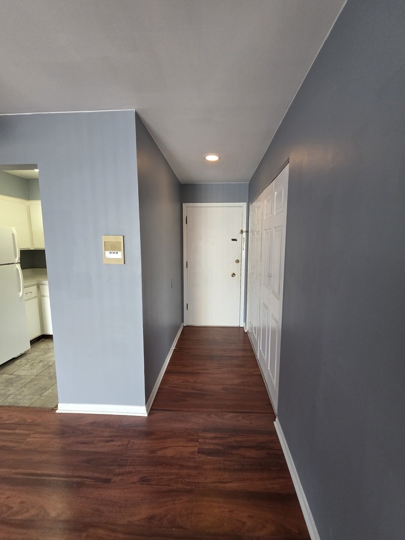 336 Lathrop Avenue, Unit 502 Forest Park, IL 60130 - Photo 16 of 38 a view of a hallway with wooden floor