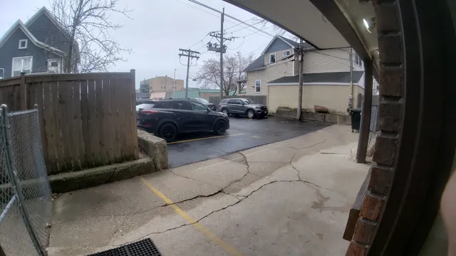 a view of a building with car parked