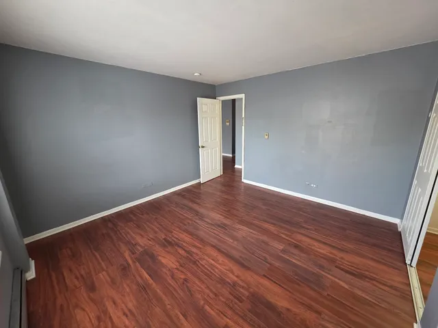 a view of gallery with wooden floor