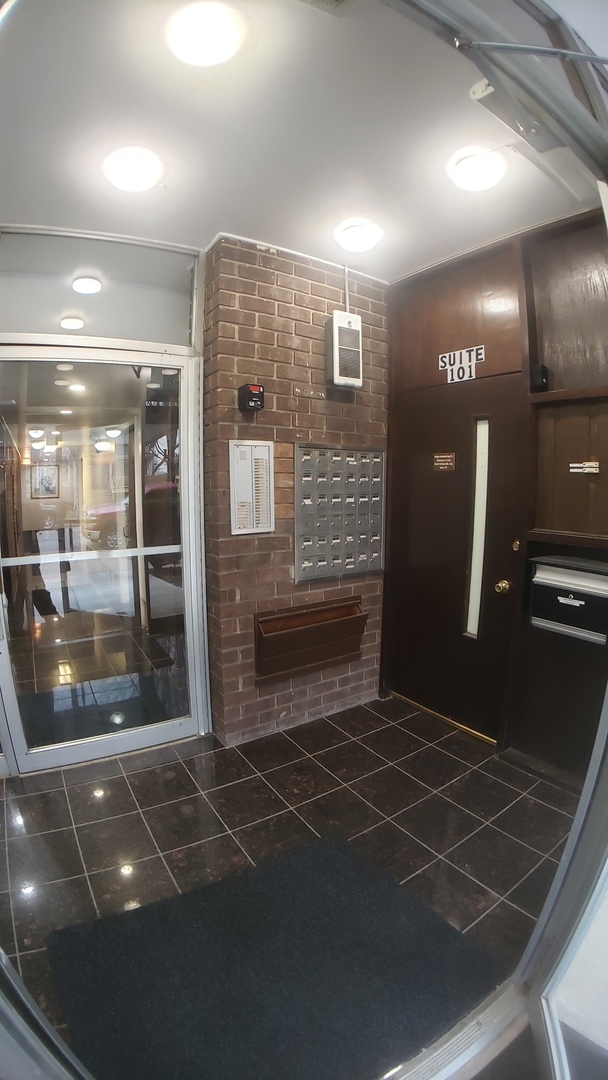 336 Lathrop Avenue, Unit 502 Forest Park, IL 60130 - Photo 3 of 38 a lobby with a glass door
