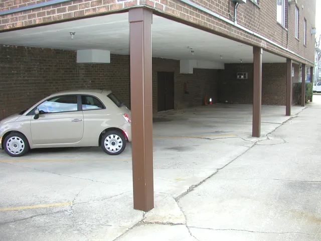 a view of street with parked cars