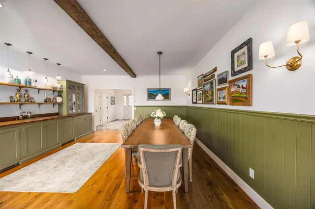 a kitchen with stainless steel appliances granite countertop a sink and a refrigerator