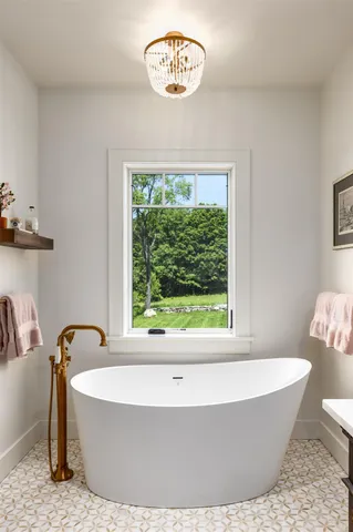 a white bath tub sitting in a bathroom