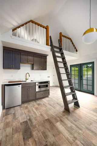a kitchen with stainless steel appliances granite countertop a stove and a kitchen island