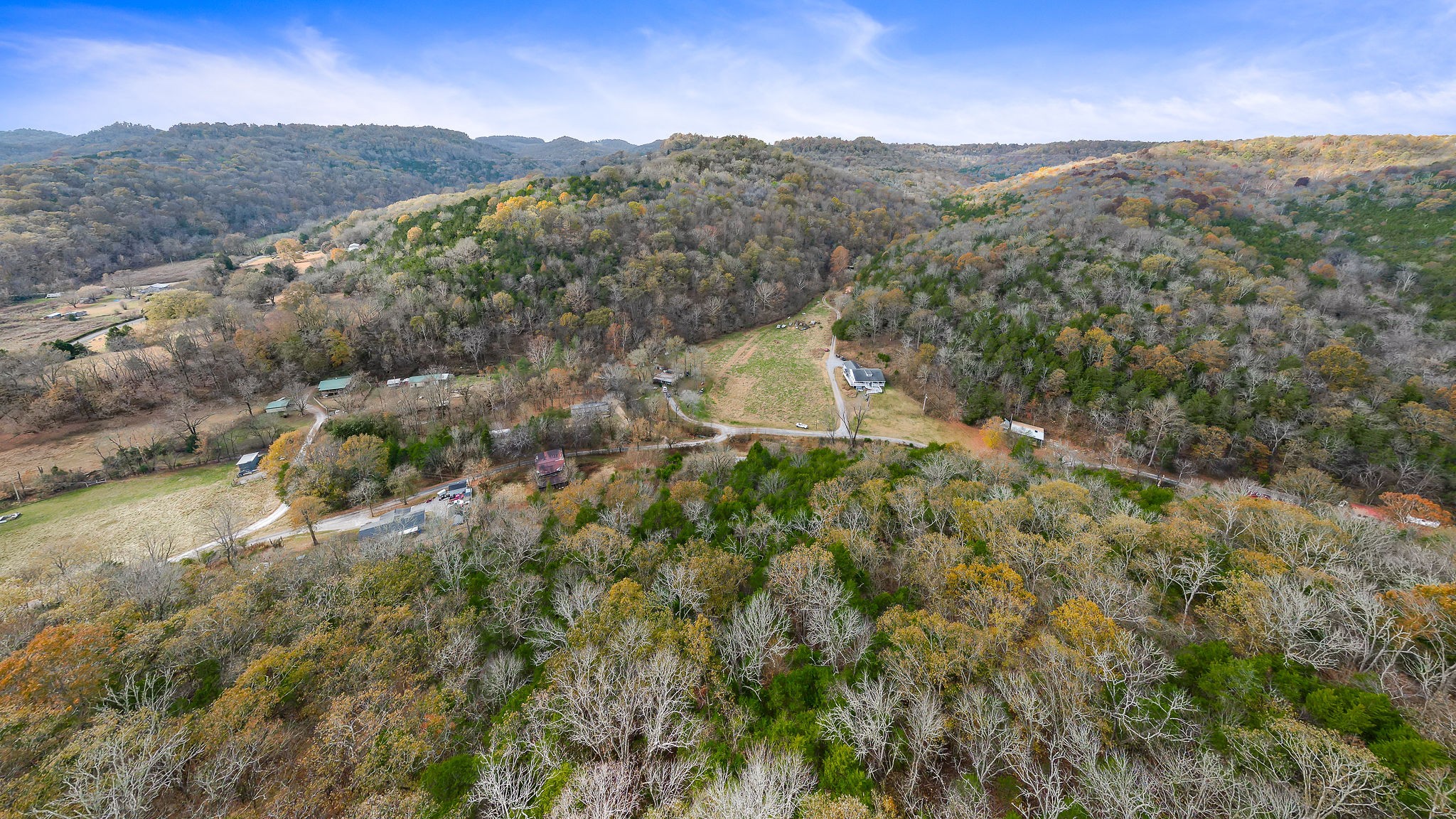308 Pumpkin Hollow Road Liberty, TN 37095 - Photo 22 of 27 a view of a lush green hillside and a building