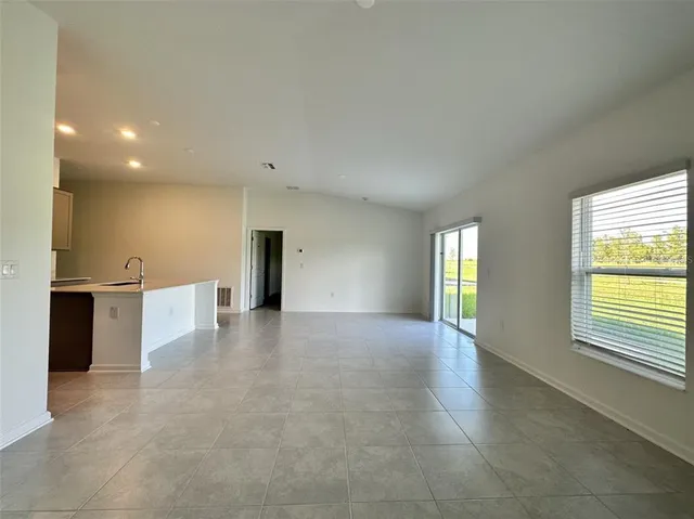 a bathroom with a shower and a glass door
