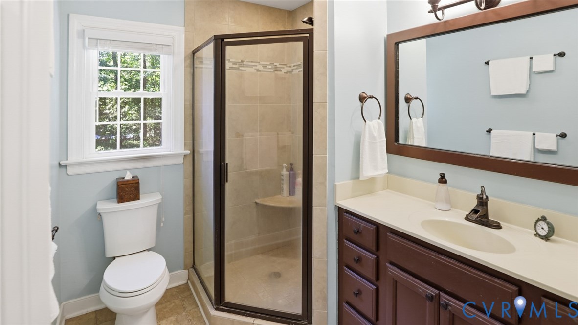 10716 Chalkley Road Richmond, VA 23237 - Photo 30 of 46 a bathroom with a sink toilet and shower