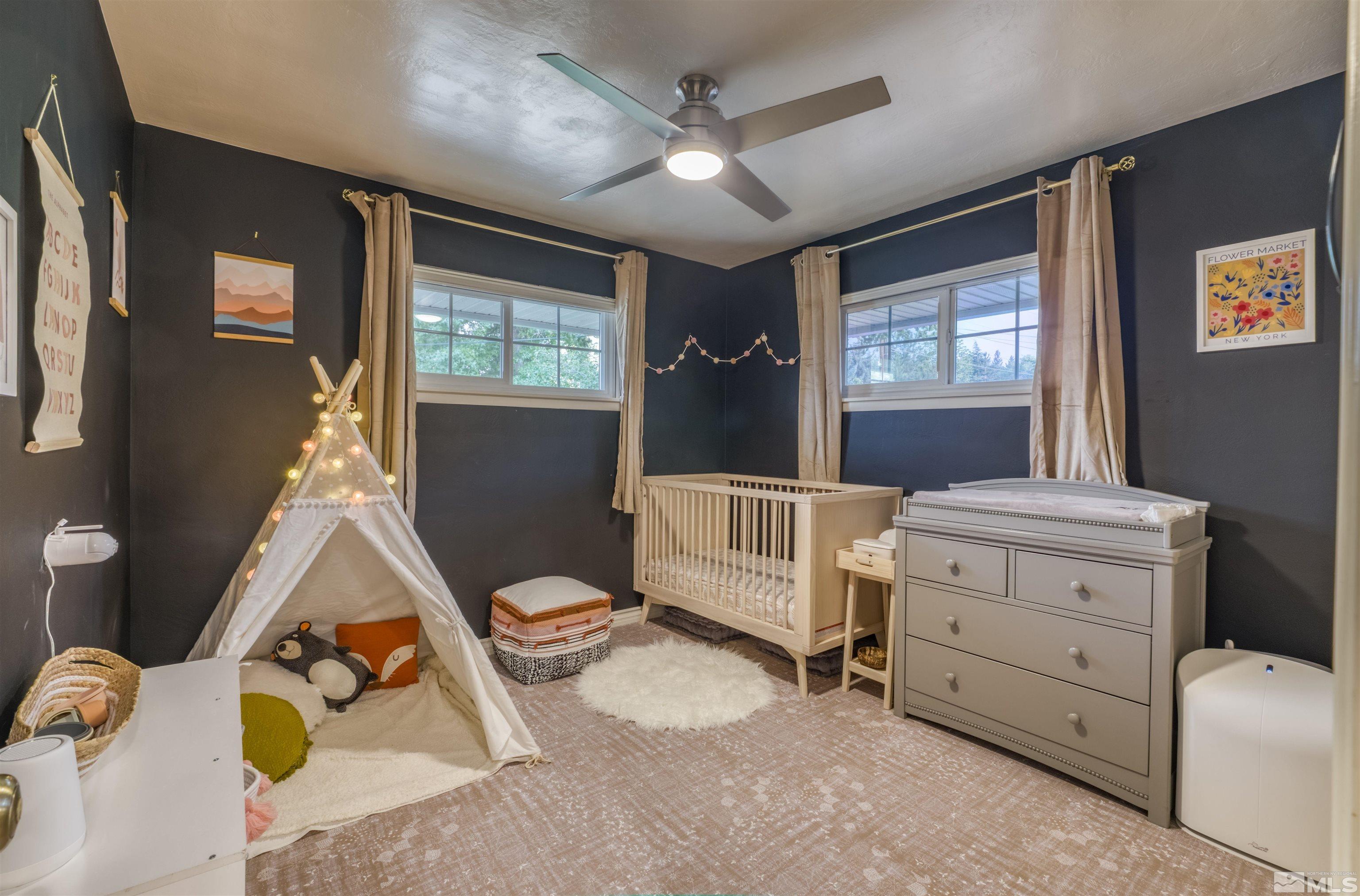1795 Hunter Lake Drive Reno, NV 89509 - Photo 16 of 32 a bedroom with a bed and wooden floor