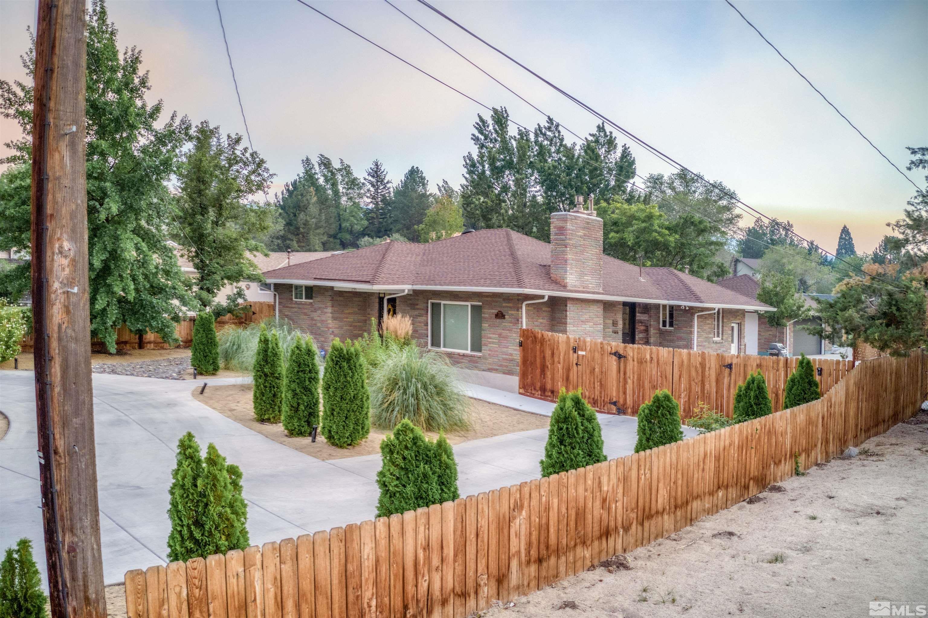 1795 Hunter Lake Drive Reno, NV 89509 - Photo 3 of 32 a front view of a house with a yard
