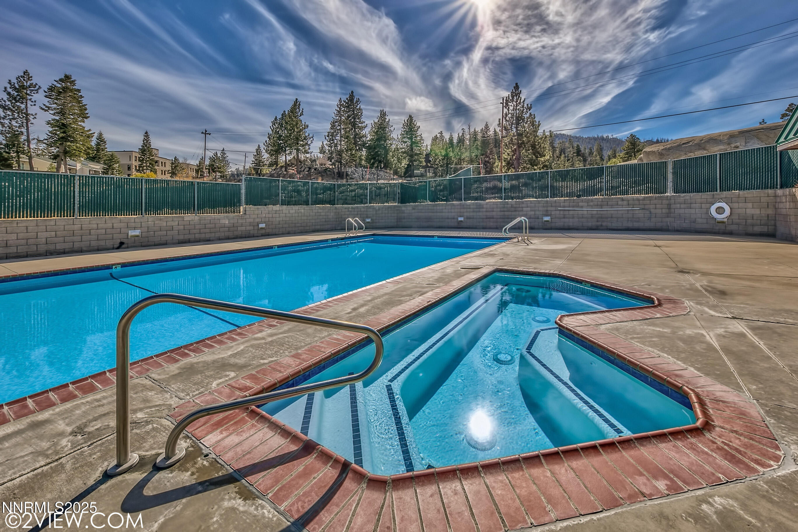 305 Galaxy Lane, Unit 3 Stateline, NV 89449 - Photo 28 of 49 a view of a swimming pool with a patio and a yard