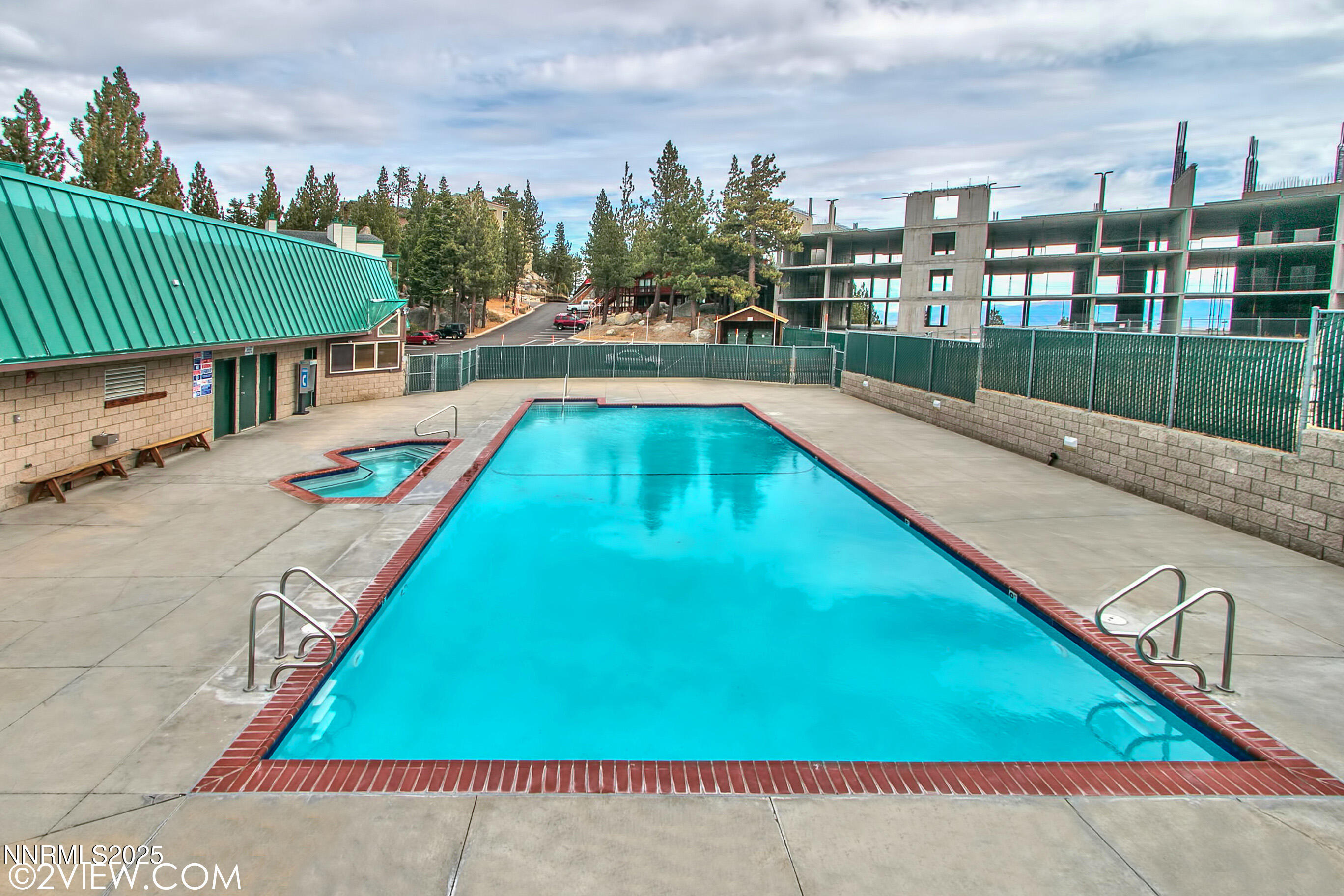 305 Galaxy Lane, Unit 3 Stateline, NV 89449 - Photo 29 of 49 a view of a swimming pool with a lounge chairs