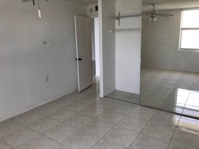 111 Briny Avenue, Unit 806 Pompano Beach, FL 33062 - Photo 15 of 40 an empty room with windows