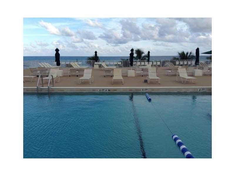111 Briny Avenue, Unit 806 Pompano Beach, FL 33062 - Photo 22 of 40 a bathroom with a sink and a mirror