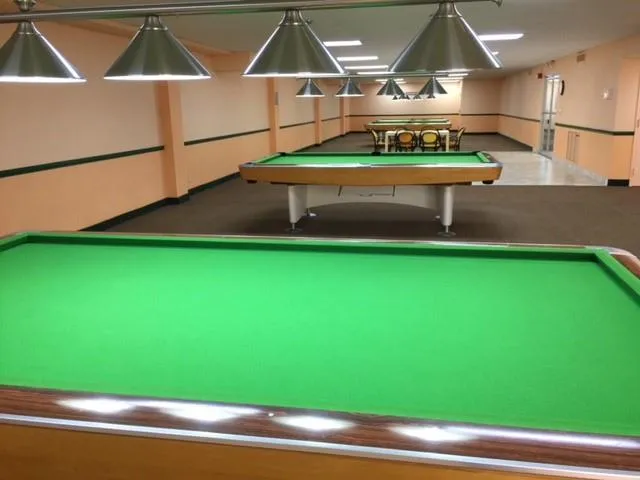 a swimming pool with outdoor seating and yard