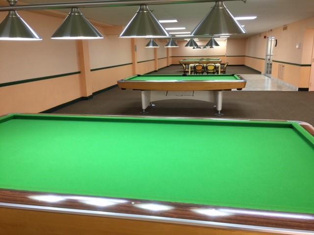 111 Briny Avenue, Unit 806 Pompano Beach, FL 33062 - Photo 29 of 40 a room with pool table and chairs