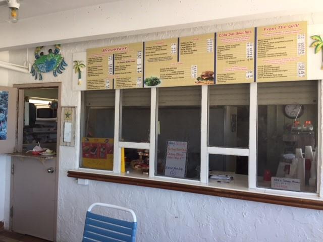 111 Briny Avenue, Unit 806 Pompano Beach, FL 33062 - Photo 36 of 40 a view of a balcony with a floor to ceiling window and wooden floor