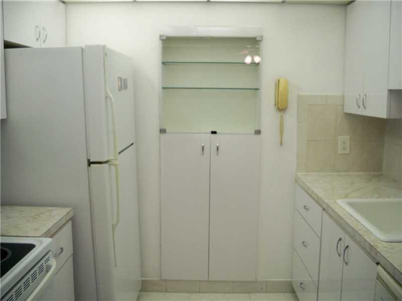 111 Briny Avenue, Unit 806 Pompano Beach, FL 33062 - Photo 4 of 40 a view of cabinets