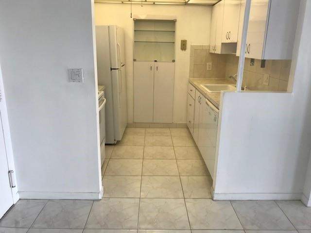 111 Briny Avenue, Unit 806 Pompano Beach, FL 33062 - Photo 7 of 40 a bathroom with a sink and a shower